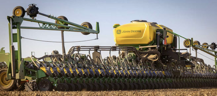 John Deere planter sweeping across a field